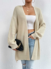 Longline knit open cardigan in Pastel Yellow with ribbed texture and eyelet detail on sleeves.