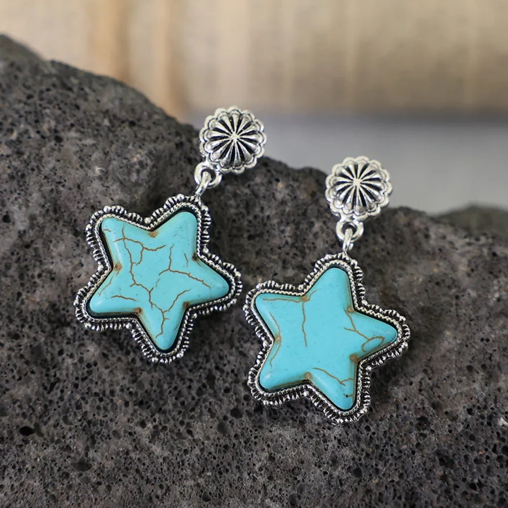 Southwestern starburst drop earrings in sky blue with cracked detail and silver-tone alloy.