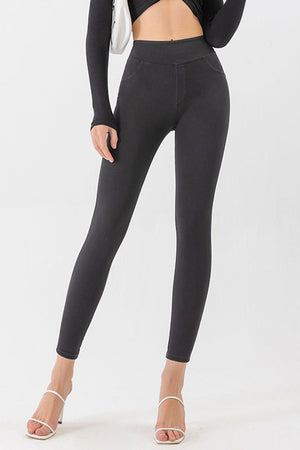 Dark gray denim-effect leggings with a sculpted fit and faux pocket details.
