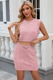 Blush pink ribbed crop top and mini skirt set with drawstring waist.