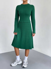 Green ribbed knit fit-and-flare co-ord set with long sleeves and a pleated skirt.