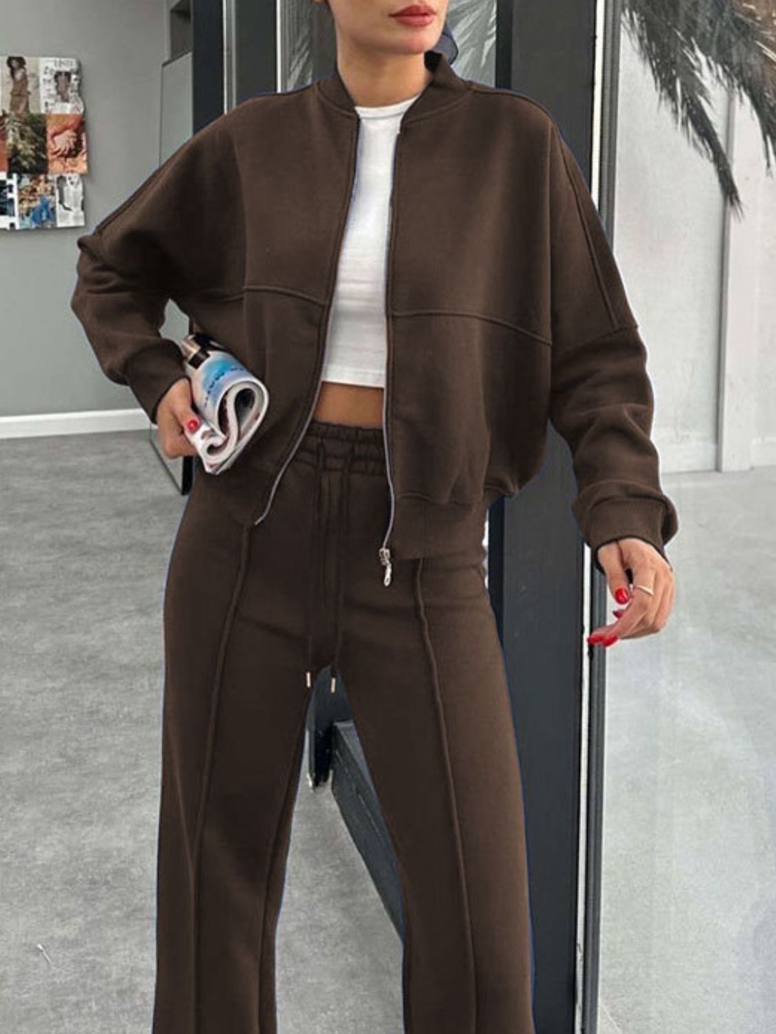 Crimson bomber jacket and wide-leg tracksuit in coffee brown, featuring a zip-up front and drawstring waist.