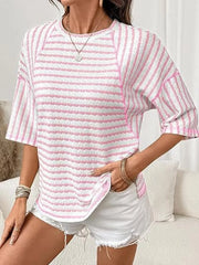 Pink and white wavy stripe knit t-shirt with relaxed fit and crew neck.