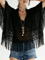 Black lace fringe cover-up with airy bohemian style and V-neckline.