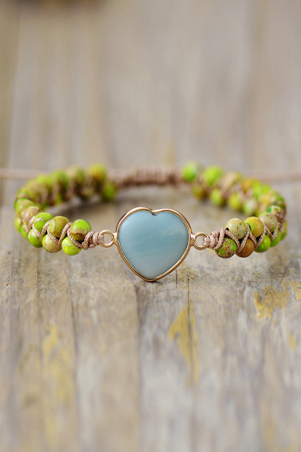 Heart stone beaded bracelet with sky blue stone and green beads on twine.