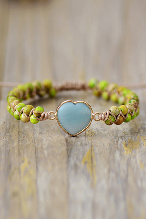 Heart stone beaded bracelet with sky blue stone and green beads on twine.