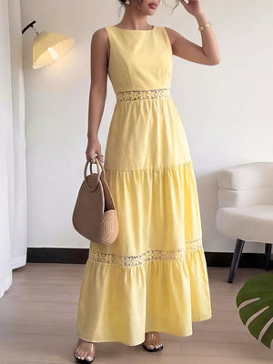 Yellow tiered maxi dress with lace trim and cutout waist detail, sleeveless, round neck