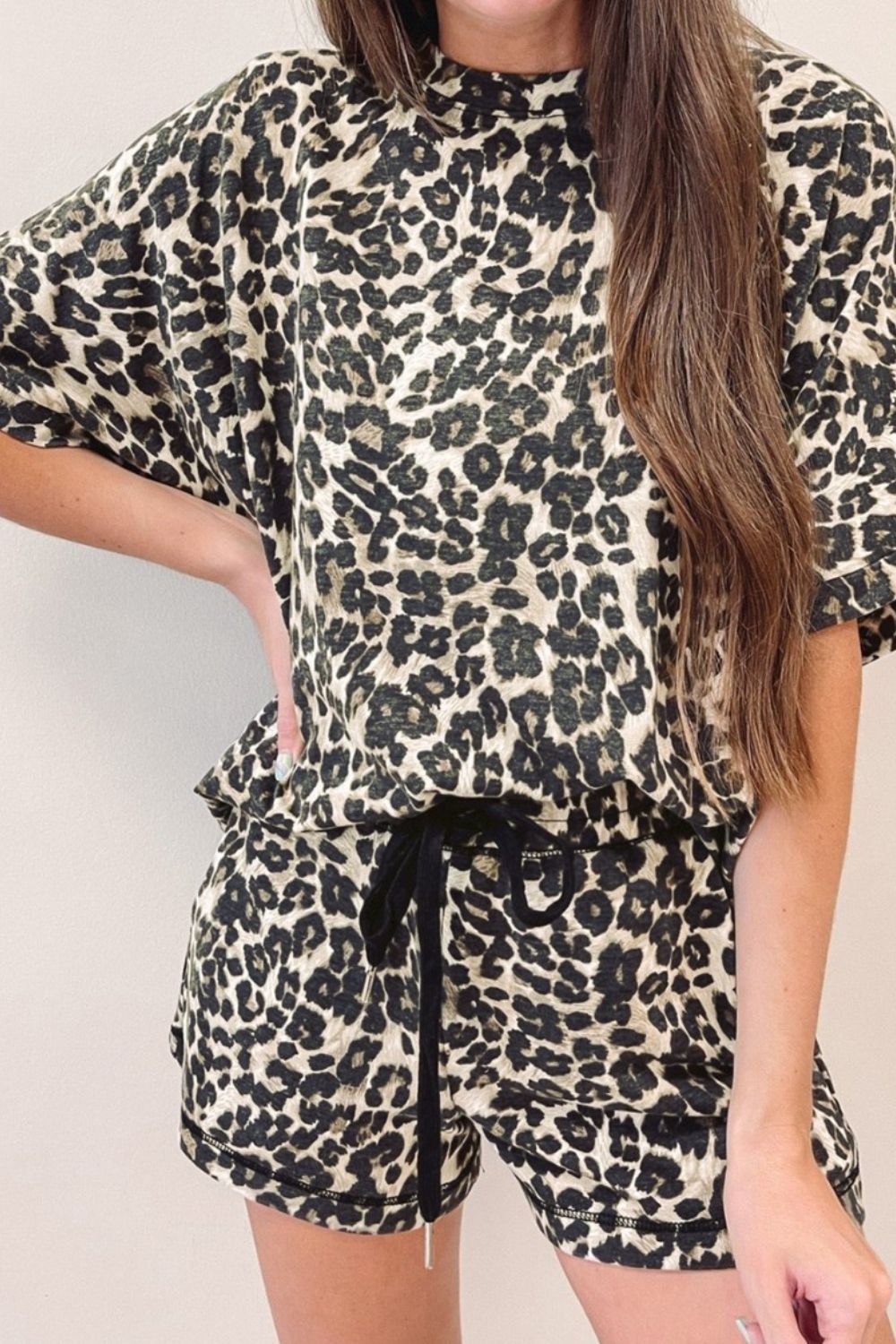 Leopard print loungewear set with a relaxed fit top and drawstring shorts.