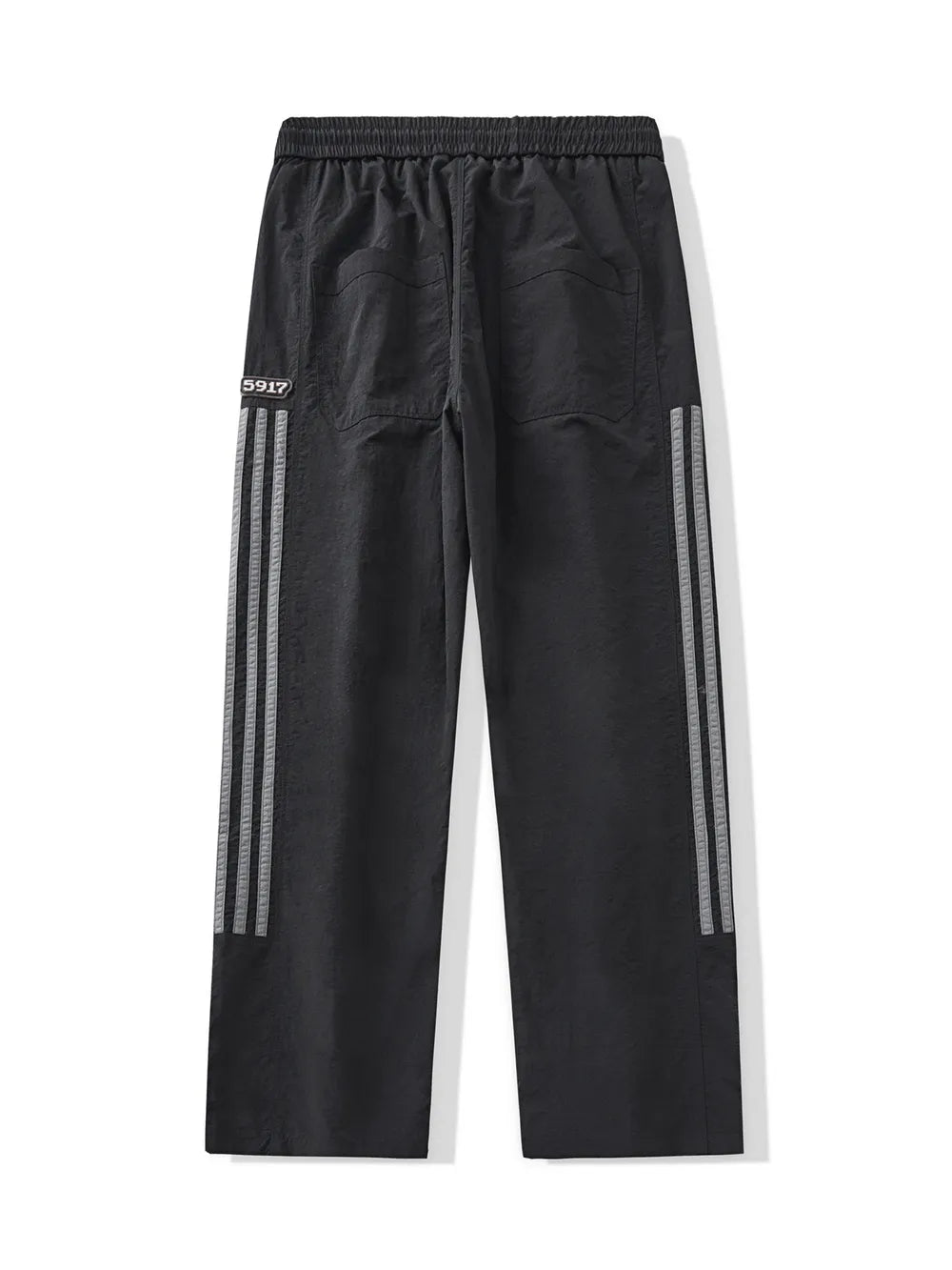 Black men's drawstring sweatpants with reflective side stripes and back pockets.
