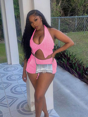 Pink knit halter top with cut-out detail and matching shorts.