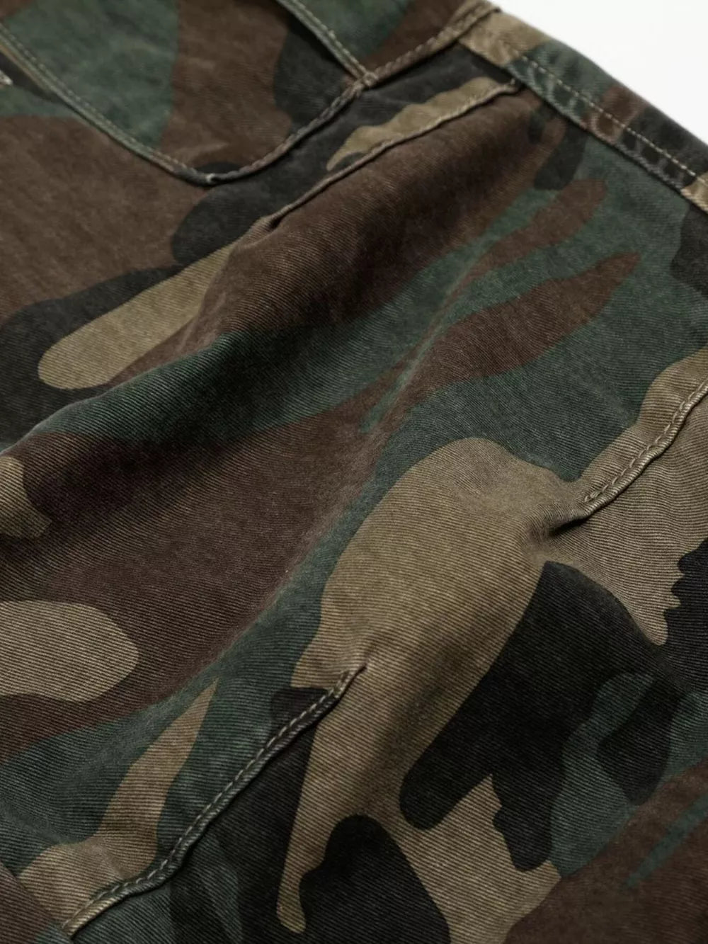 Distressed camouflage cargo pants for men with multiple pockets and stitching details.