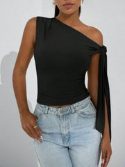 Black asymmetrical tie detail cropped blouse with one sleeve and tie detail.