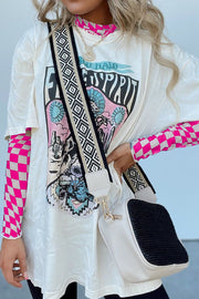 White graphic tee with pink checkered mesh long sleeve shirt underneath.