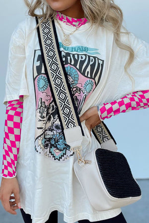 White graphic tee with pink checkered mesh long sleeve shirt underneath.