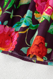 Embroidered floral babydoll blouse in floral print with a ruffled hem detail.