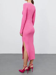 Hot pink ribbed midi dress with high slit and long sleeves.