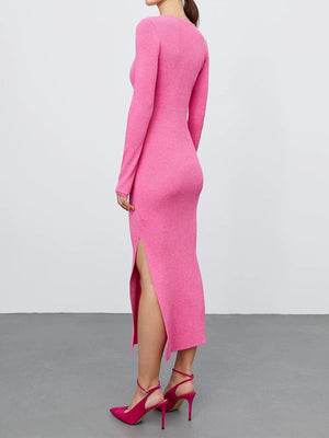 Hot pink ribbed midi dress with high slit and long sleeves.
