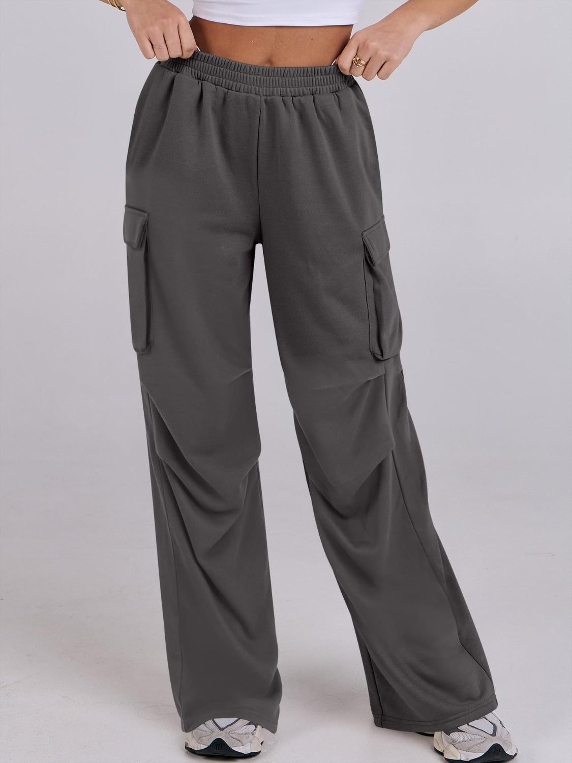 Dark Gray sweatpants with cargo pockets and a wide leg cut.
