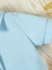Blue baby outfit detail showing sleeve and collar seam