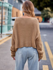 Camel knit sweater with textured pattern and relaxed fit.