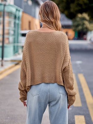 Camel knit sweater with textured pattern and relaxed fit.