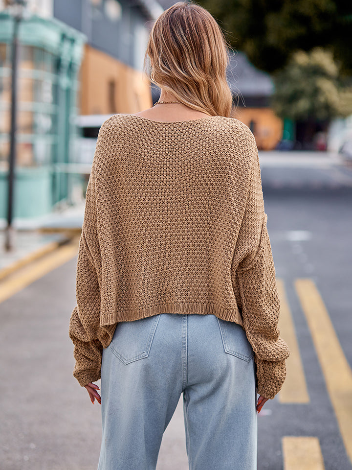 Camel knit sweater with textured pattern and relaxed fit.