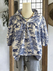 Toile de Jouy half sleeve blouse with a collared neckline and gathered details.