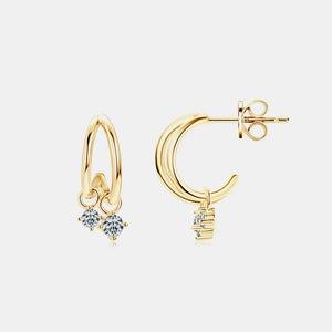 Gold cubic drop hoop earrings with clear cubic zirconia accents.