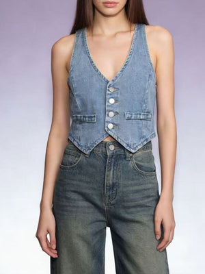 Light blue cropped denim vest with button-down front and two chest pockets.