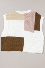 Patchwork cable knit tank top in white, dusty pink, brown, and tan acrylic with mixed stitch patterns.
