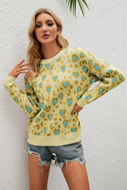 Light Yellow heart print drop shoulder sweater with crewneck and long sleeves.