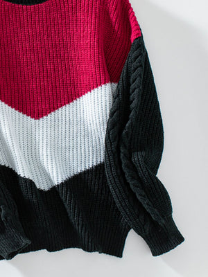 Chevron colorblock cable knit sweater in red, white, and black with cable knit sleeves.