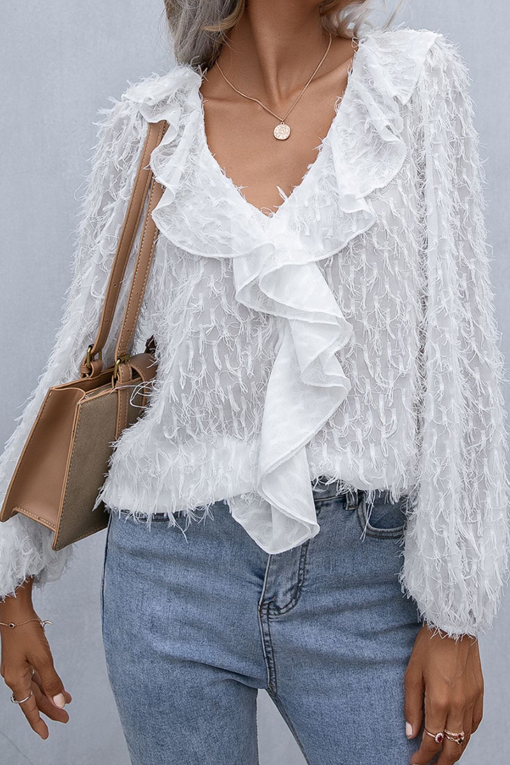 White textured ruffle front blouse with balloon sleeves and V-neck