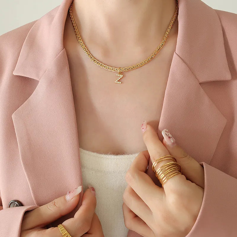 Gold textured chain necklace with a crystal initial Z charm