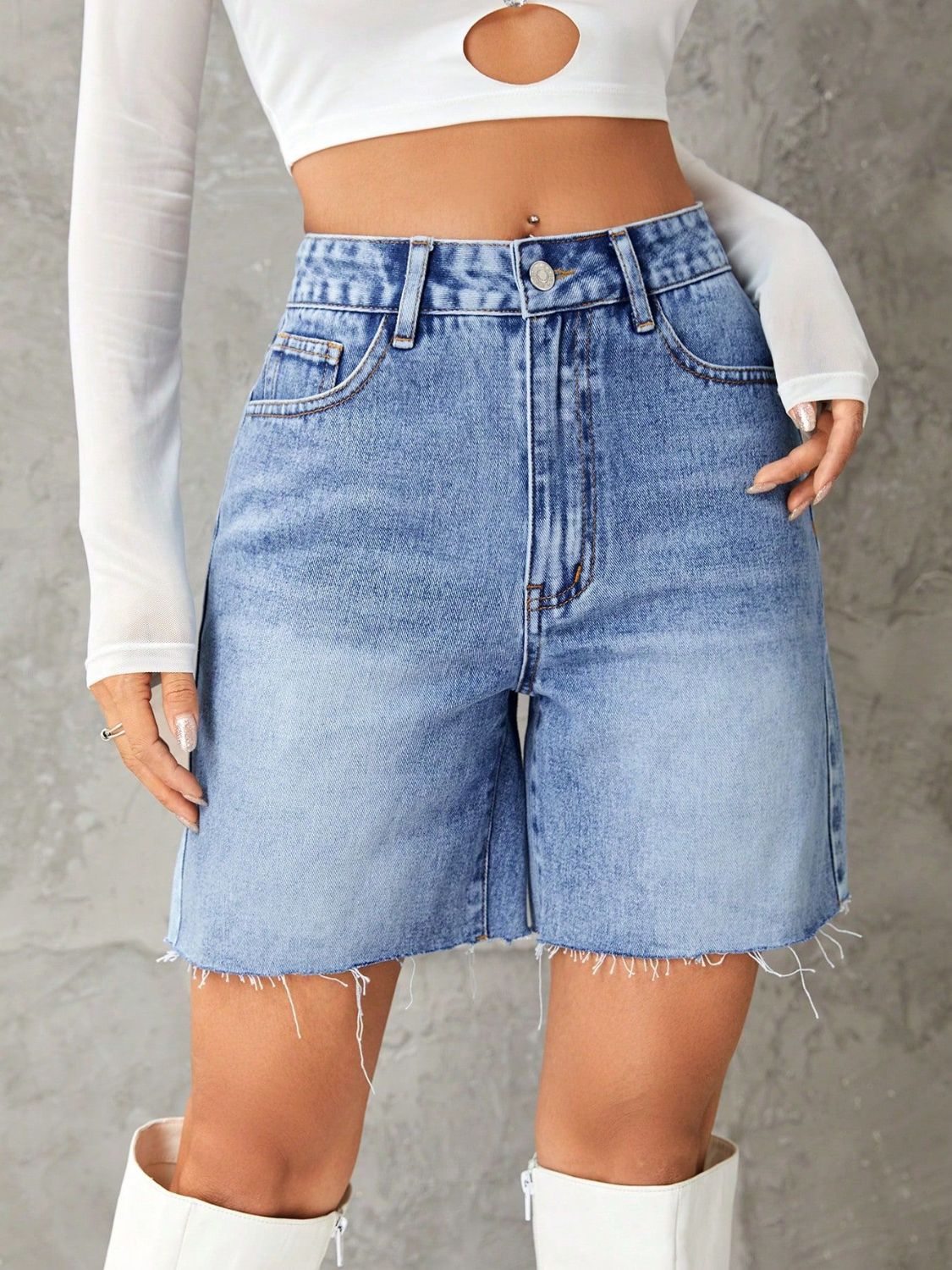 Light blue denim bermuda shorts with frayed hem and high waist.