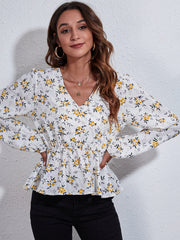 White floral peplum blouse with gathered waist and V-neck