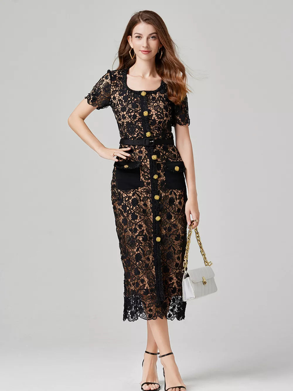 Black lace midi dress with button-down front, pockets, and gold button details.