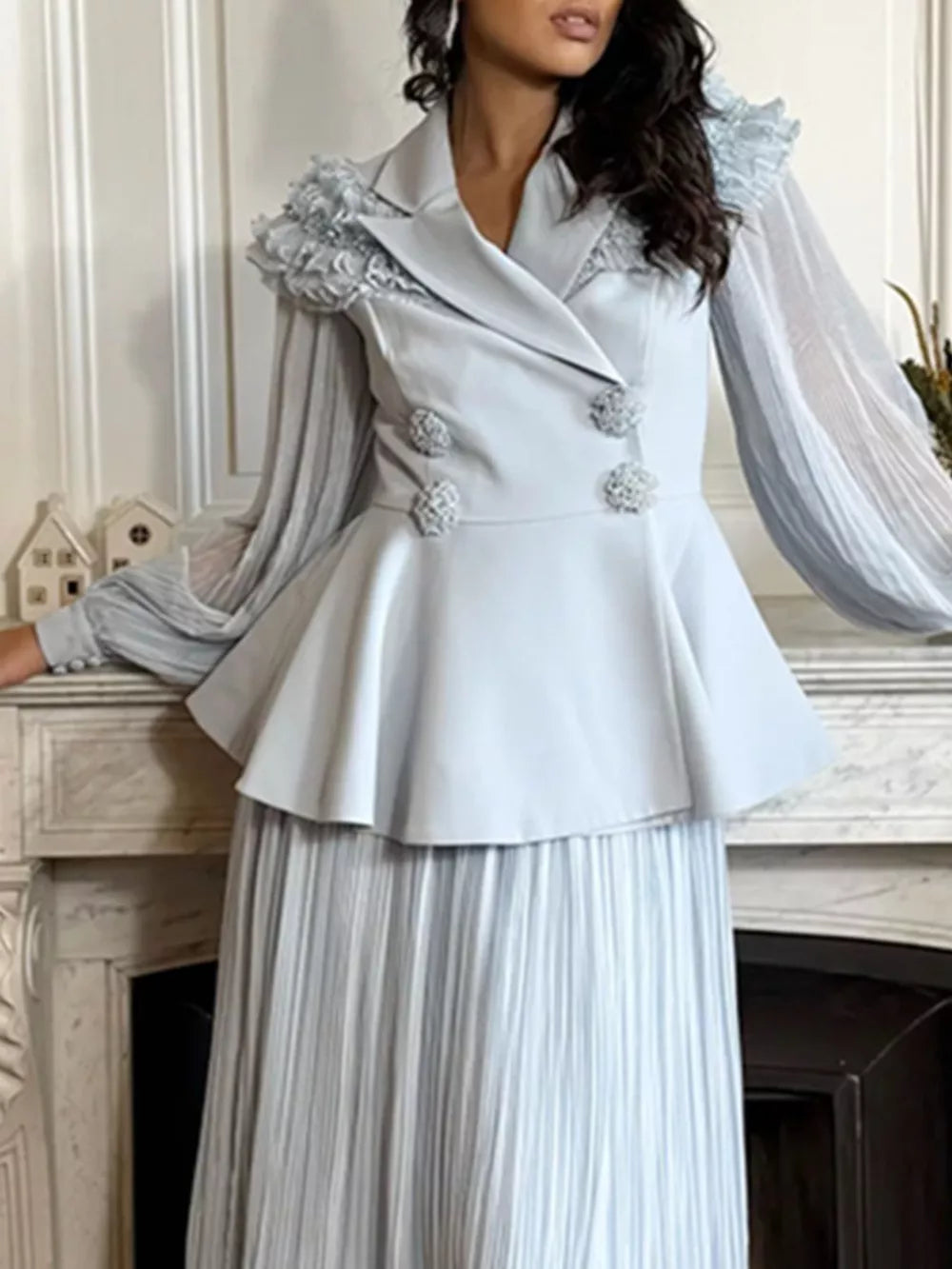 Blue skirt suit with frill collar, balloon sleeves, peplum jacket and pleated skirt.