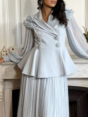 Blue skirt suit with frill collar, balloon sleeves, peplum jacket and pleated skirt.
