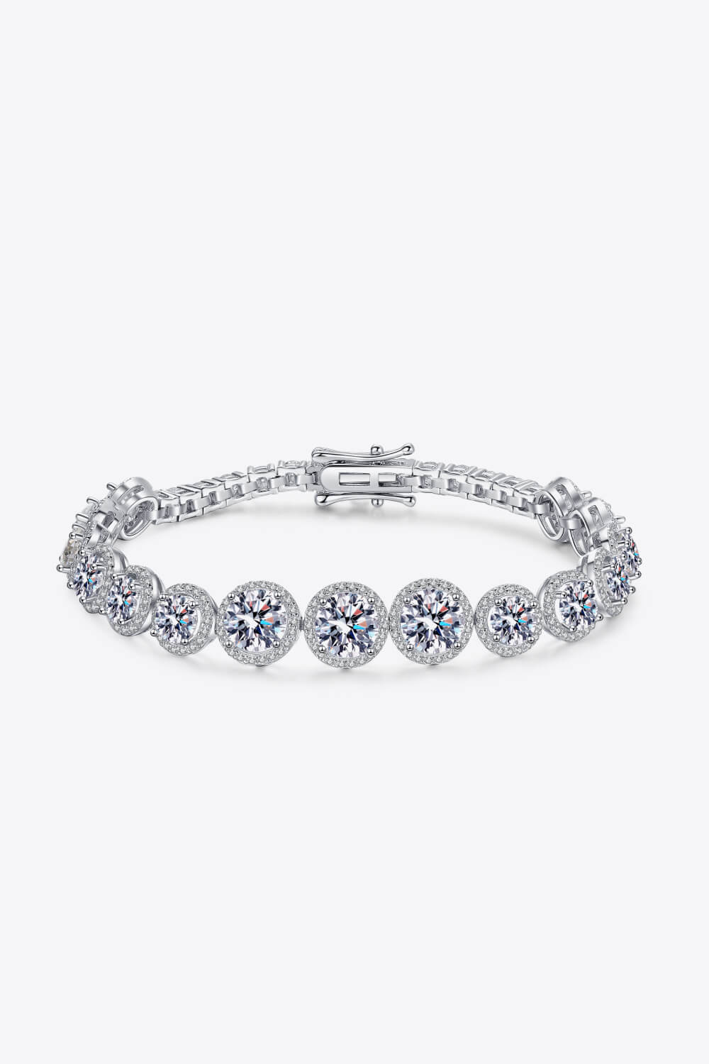 Silver moissanite tennis bracelet with halo detail and clasp closure.