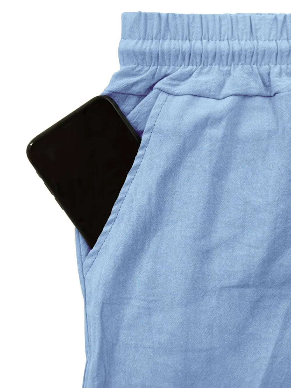 Light blue relaxed-fit cargo pants with drawstring waist and pocket detail.