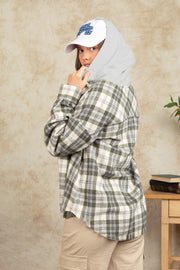 Cozy plaid shacket with sherpa hood in green and white, buttoned, casual style.