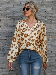 Leopard print henley blouse with blouson sleeves in beige and brown.