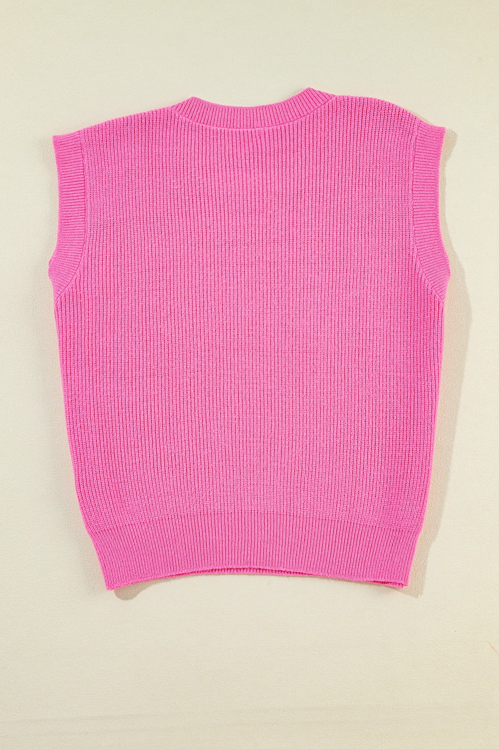 Fuchsia pink knit tank top with ribbed texture and crew neck.