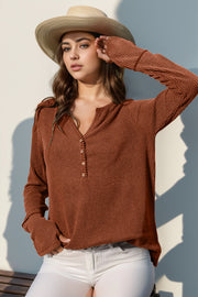 Caramel waffle knit henley shirt with thumbhole cuffs and button placket.
