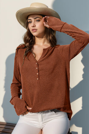Caramel waffle knit henley shirt with thumbhole cuffs and button placket.