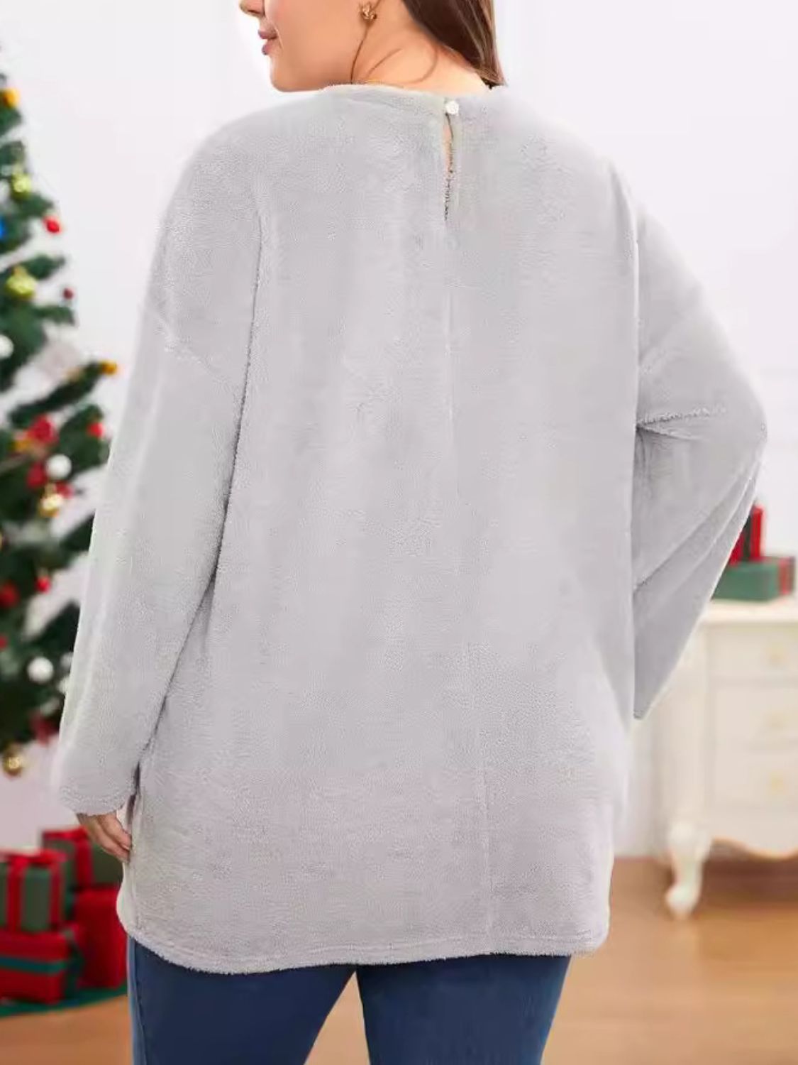 Light gray plush cocoon dress with long sleeves and a button closure at the back neck.