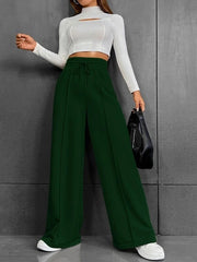 Dark green wide-leg sweatpants with drawstring waist and front seams.