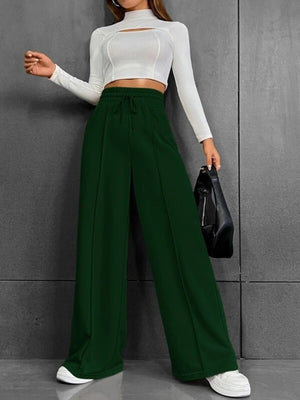 Dark green wide-leg sweatpants with drawstring waist and front seams.