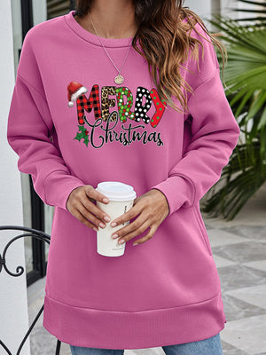 Pink tunic sweatshirt with festive Merry Christmas graphic and Santa hat detail.